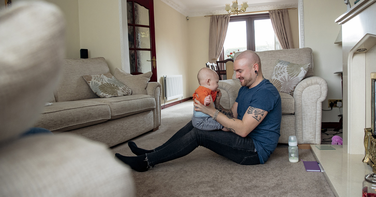 A father hold his toddler son.