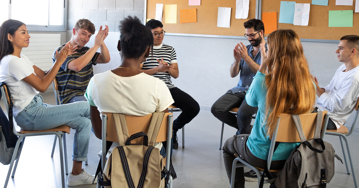 a group of people sitting in a circle