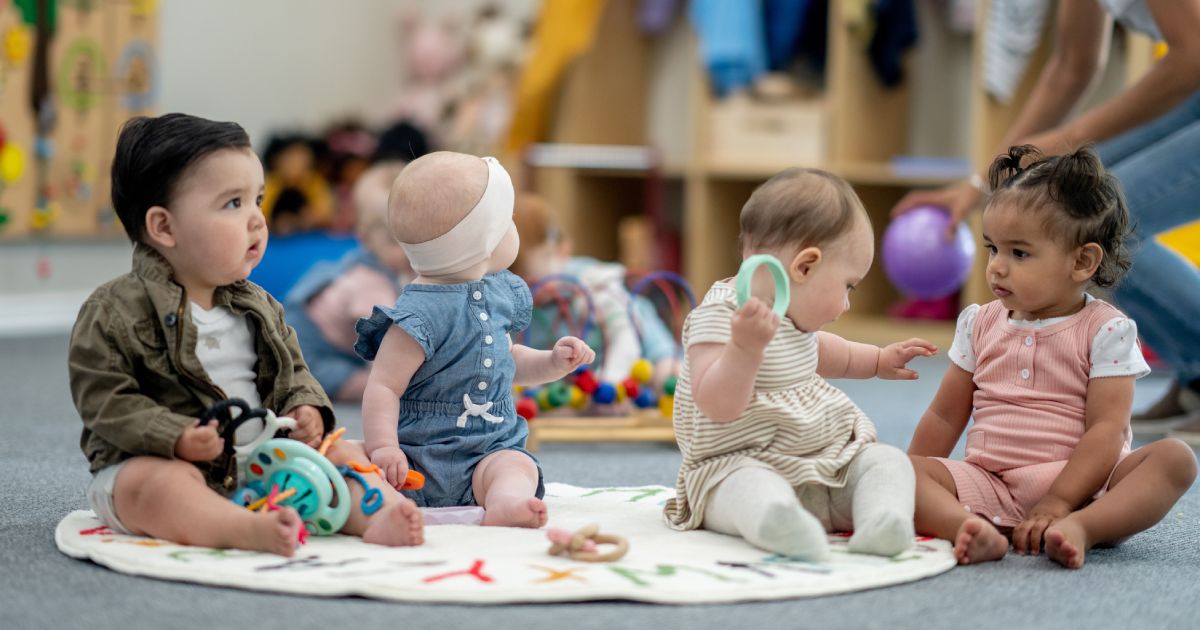 Babies playing on the floor in a daycare